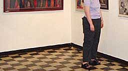 A gallery patron enjoys the exhibition
