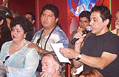 Reyes Rodriguez of Tropical de Nopal Gallery asks questions of the Self-Help board