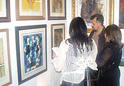Art lovers viewing the works of Latin American masters on opening night
