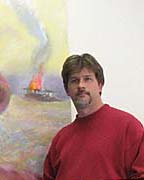 John Paul Thornton at work on a painting to be unveiled at the exhibition. 