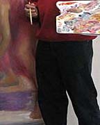 John Paul Thornton at work on a painting to be unveiled at the exhibition. 